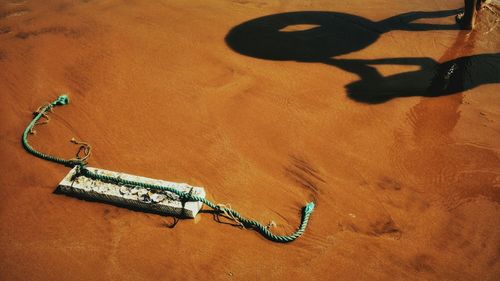 High angle view of shadow on sand