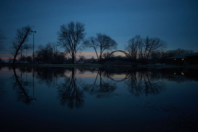 Scenic view of lake against sky at dusk