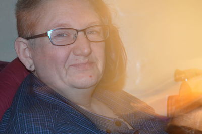 Close-up portrait of woman at home
