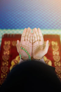 Close-up of woman hand over blurred background