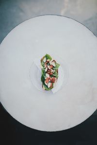 High angle view of vegetables in plate on table