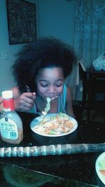 Close-up of woman eating food