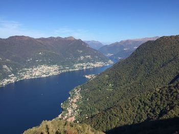 Scenic view of mountains against blue sky