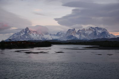 Scenic view of lake and mountains against sky