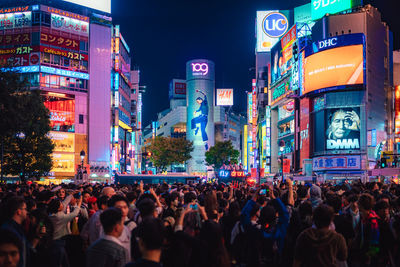 People on street in city at night