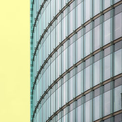 Low angle view of fence against building