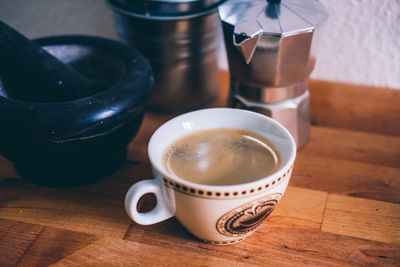 High angle view of coffee cup on table