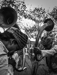 Rear view of people looking at camera