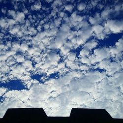 Low angle view of building against cloudy sky