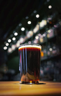 Close-up of beer glass on table