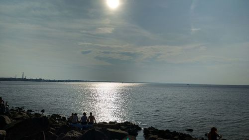 Scenic view of sea against sky at sunset