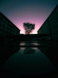 Scenic view of lake against sky at night