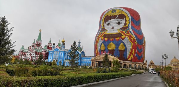 Panoramic view of multi colored buildings against sky in city