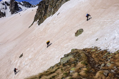 High angle view of people on rock