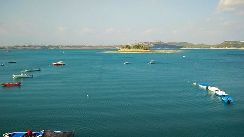 High angle view of boats sailing in sea against sky