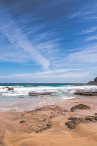 Scenic view of beach against sky