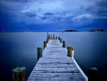 Pier over sea against sky