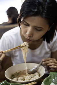 Close-up of girl eating food