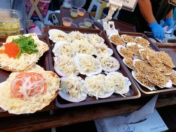 Close-up of hand holding food in plate