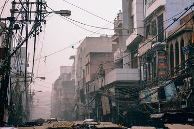 Cars on street amidst buildings in city