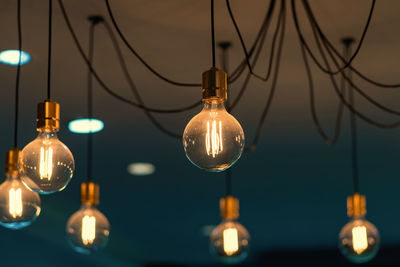 Low angle view of illuminated light bulb