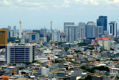 High angle view of buildings in city against sky