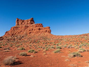 Landscape of orange and red buttes and monoliths at valley of the gods in utah