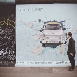 Woman standing against wall