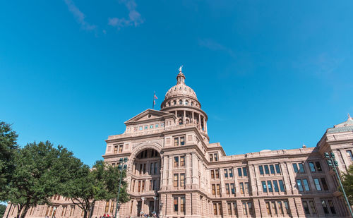 Low angle view of building against blue sky