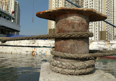 Fountain by building in city