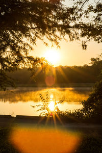 Scenic view of lake during sunset