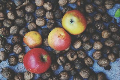 High angle view of walnuts and apples