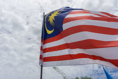 Low angle view of malaysian flag against sky