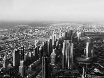 High angle view of modern buildings in city against sky