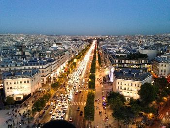 High angle view of illuminated city street against sky