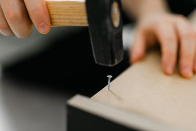 Cropped hand of man working in workshop