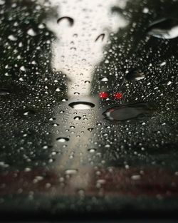 Close-up of wet glass window in rainy season