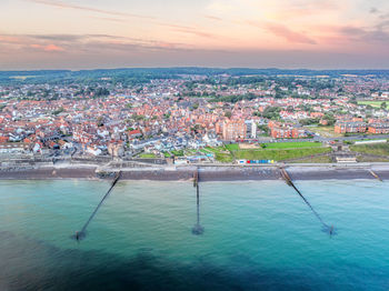 High angle view of city at sunset