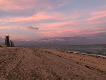 Scenic view of beach against sky during sunset