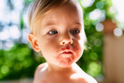 Close-up of baby girl at home