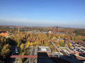 View of cityscape against blue sky