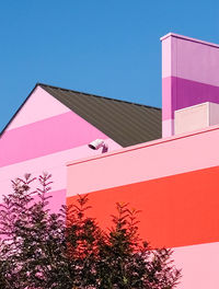 Low angle view of building against clear blue sky