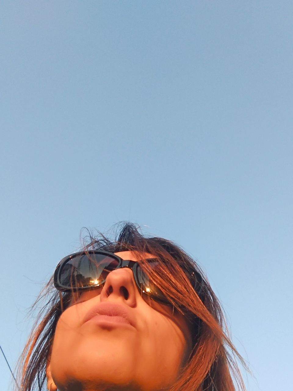 PORTRAIT OF WOMAN AGAINST CLEAR SKY