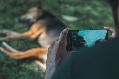 Midsection of person photographing