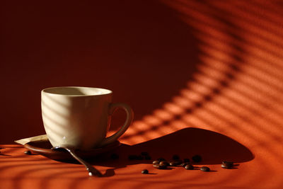 Close-up of coffee cup on table