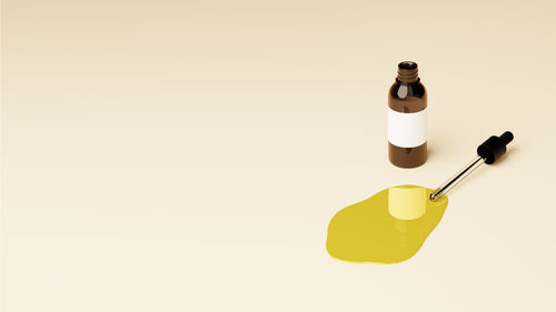 Close-up of bottle against pink background