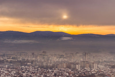 High angle view of city at sunset