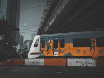 Train on railroad tracks in city