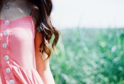 Midsection of woman on field at park