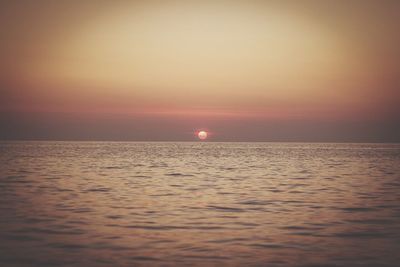 Scenic view of sea at sunset